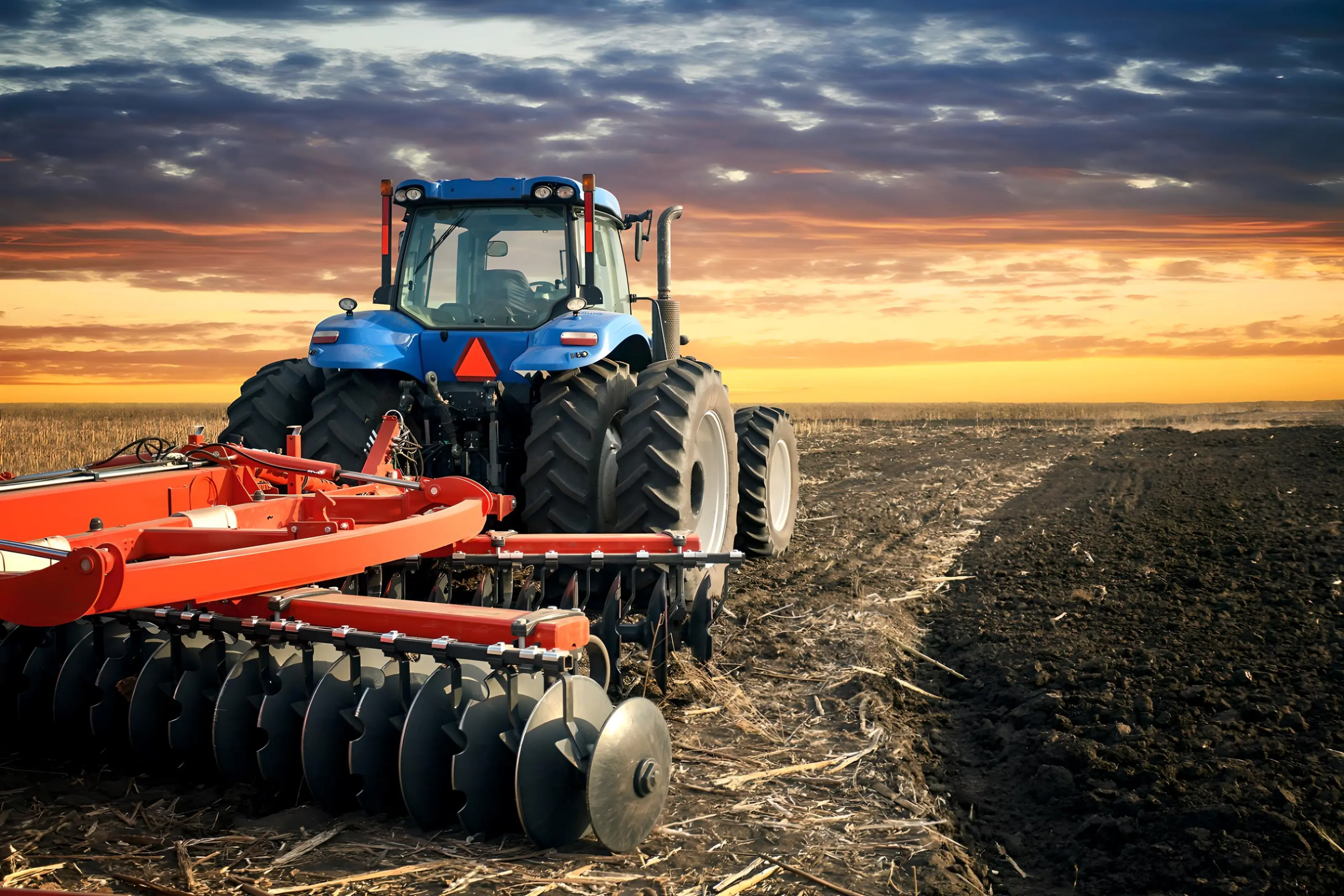 Tractor in the field in the evening